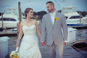 Bride and groom holding hand at Crystal Point Yacht Club NJ Wedding Photographer - Alyssa and Joey's Wedding at Crystal Point Yacht Club