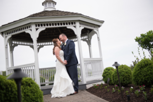 Newlyweds standing and holding hand at Crystal Point Yacht Club wedding