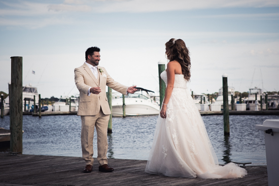 Groom smiling at bride during first look
