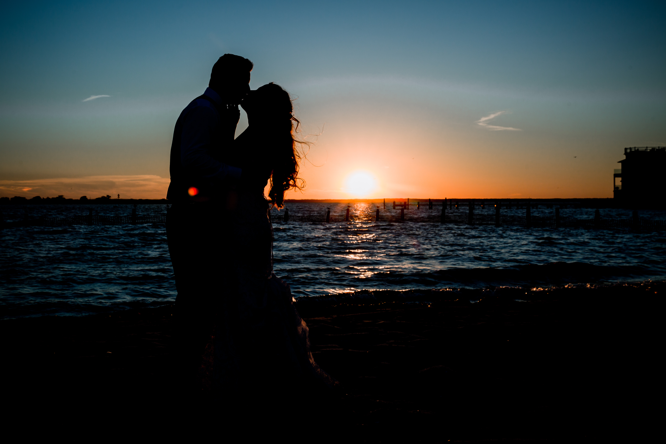 Couple kissing at Brant Beach Yacht club wedding photos