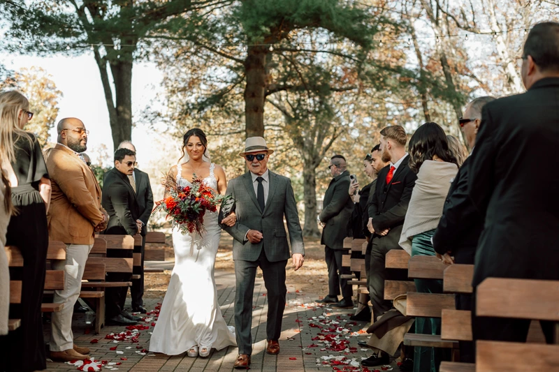 Walking down the aisle with dad at The Pavilion on Crystal Lake wedding photos