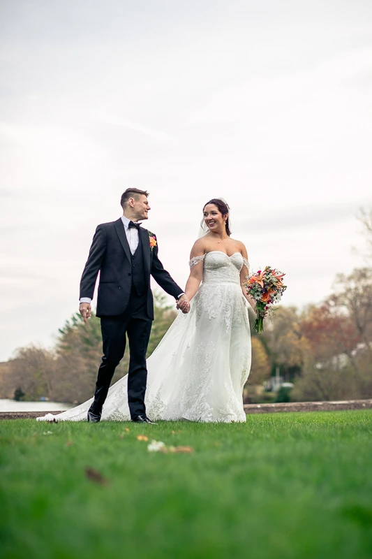Hand-in-hand stroll at The Pavilion on Crystal Lake wedding photos