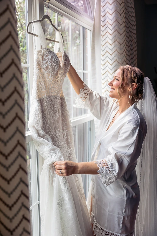 Bride admiring her gown at Penn Oaks Golf Club Wedding Photos