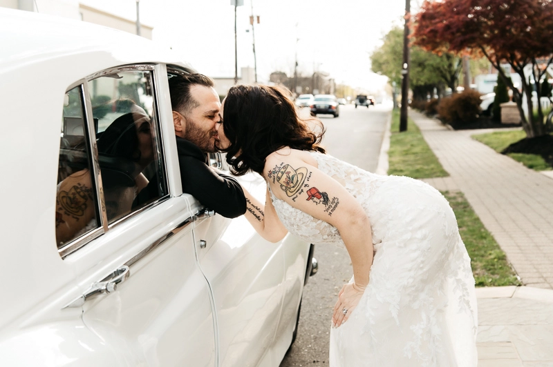 A sweet moment by the classic car The Westwood wedding photos