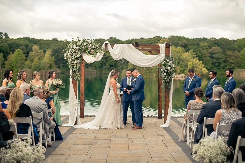 Saying "I do" by the Water Rock Island Lake Club wedding photos